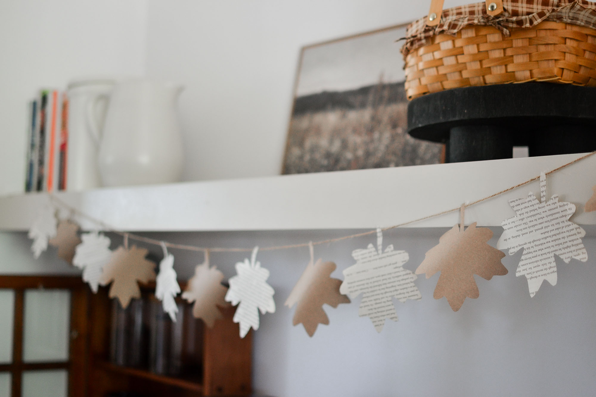 a finished paper leaf garland hanging on a shelf
